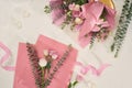 Mothers day, valentines day, birthday concept, Making pink flower bouquet with scissors on white background