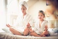 Mothers and little girl morning routine. Royalty Free Stock Photo