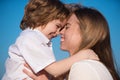 Mothers love. Closeup portrait of mother and child kissing. Mother hugging and embracing son. Mothers day, love family