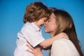 Mothers love. Closeup portrait of mother and child kissing. Mother hugging and embracing son. Mothers day, love family