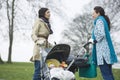 Mothers With Strollers In Park Having Chat Royalty Free Stock Photo