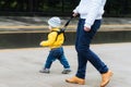 Mom insures her child during a walk