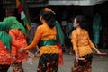 Mothers wearing Javanese traditional clothes, kebaya and batik cloth on the streets