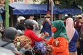 Mothers wearing Javanese traditional clothes, kebaya and batik cloth on the streets