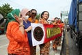 Mothers wearing Javanese traditional clothes, kebaya and batik cloth on the streets