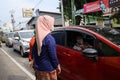 Mothers wearing Javanese traditional clothes, kebaya and batik cloth on the streets