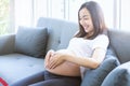 Mothers wearing wedding rings are making heart-shaped hands on their pregnant belly Royalty Free Stock Photo