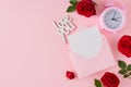 Flat lay composition made of red roses, open envelope with card, inscription love you, alarm clock Royalty Free Stock Photo