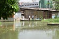 MOTIJHEEL,DHAKA/BANGLADESH-JULY 09 2020: Small Wooden Boat Carry Passenger In Small Lake Near Central Bank Of Bangladesh