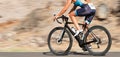 Motion blur of a bike race with the bicycle and rider at high speed. Royalty Free Stock Photo