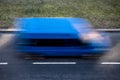 Motion blur of a blue delivery van