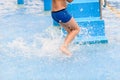 Motion blur boy running in pool. Royalty Free Stock Photo