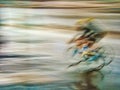 Motion blur of cyclist in the rain