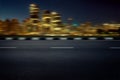 Motion Blur empty asphalt road with modern cityscape skyline at night Royalty Free Stock Photo