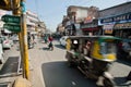 Motion blur from fast moving rickshaw on the busy street