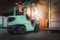 Motion Blur of Forklift Driver Loading Package Boxes into Shipping Container. Trailer Truck Parked Loading at Dock Warehouse. Royalty Free Stock Photo
