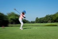 Motion blur golfer swinging driver club Royalty Free Stock Photo