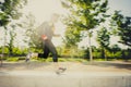 Motion blur image of young man running practicing sport in city park with extreme backlight lens flare Royalty Free Stock Photo