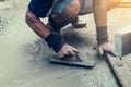 Motion blur mason building a screed coat cement at home with sunlight Royalty Free Stock Photo