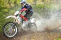 Motion blur, offroad motorbike crossing river Royalty Free Stock Photo