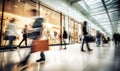 motion blur of people with shopping bags in a busy shopping mall. retail sale and discount Royalty Free Stock Photo