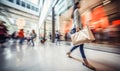 motion blur of people with shopping bags in a busy shopping mall. retail sale and discount Royalty Free Stock Photo