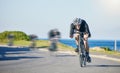 Motion blur, race and cyclist on bike on road in mountain with helmet, exercise adventure trail and speed. Cycling Royalty Free Stock Photo