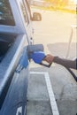 Refueling Car fills with petrol gasoline at a gas station and Petrol pump filling fuel nozzle in the fuel tank of the car Royalty Free Stock Photo