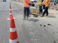 Motion blur, road construction with a red rubber cone in front Royalty Free Stock Photo