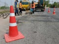 Motion blur, road construction with a red rubber cone in front Royalty Free Stock Photo