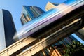 Motion blur of a skytrain speeding through a modern business district Royalty Free Stock Photo