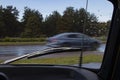 Traffic watched through the windshield of a vintage car with a chrome wiper and antenna Royalty Free Stock Photo