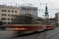 Motion blur tram with tower in background