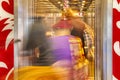 motion blur of two african people walking into a elevator