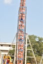 A motion blur view giant wheel or ferris wheel with the background of blue sky at india