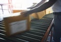 Motion Blur of Wokers Moving Package Boxes on Conveyor Belt. Supply Chain. Warehouse Distribution Center. Logistics. Royalty Free Stock Photo