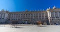 Motion blured people walking in front of Palacio Real Royal palace in a winter sunny day