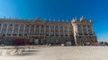 Motion blured people walking in front of Palacio Real Royal palace in a winter sunny day