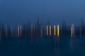 Motion Blurr of industry background with defocused cargo dock terminal in sea with colorful bokeh lights at midnight