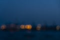 Motion Blurr of industry background with defocused cargo dock terminal in sea with colorful bokeh lights at midnight