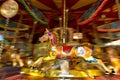 Motion blurr of vintage horse of amusement ride on merry-go-round carousel Royalty Free Stock Photo