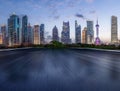 Motion blurred asphalt road and city skyline Royalty Free Stock Photo