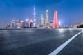 Motion blurred asphalt road and city skyline Royalty Free Stock Photo