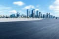 Motion blurred asphalt road and city skyline Royalty Free Stock Photo