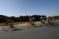 Motion blurred biker on the road. amateur cyclists train on the road early in the morning.