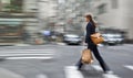 Motion blurred business people walking on the street Royalty Free Stock Photo