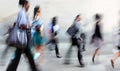 Motion blurred business people walking on the street Royalty Free Stock Photo