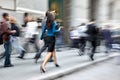 Motion blurred business people walking on the street Royalty Free Stock Photo