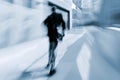 Motion blurred business people walking on the street Royalty Free Stock Photo