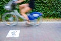 Motion blurred cyclists to show speed, driving along a bike lane, and make transport and urban displacements more sustainable
